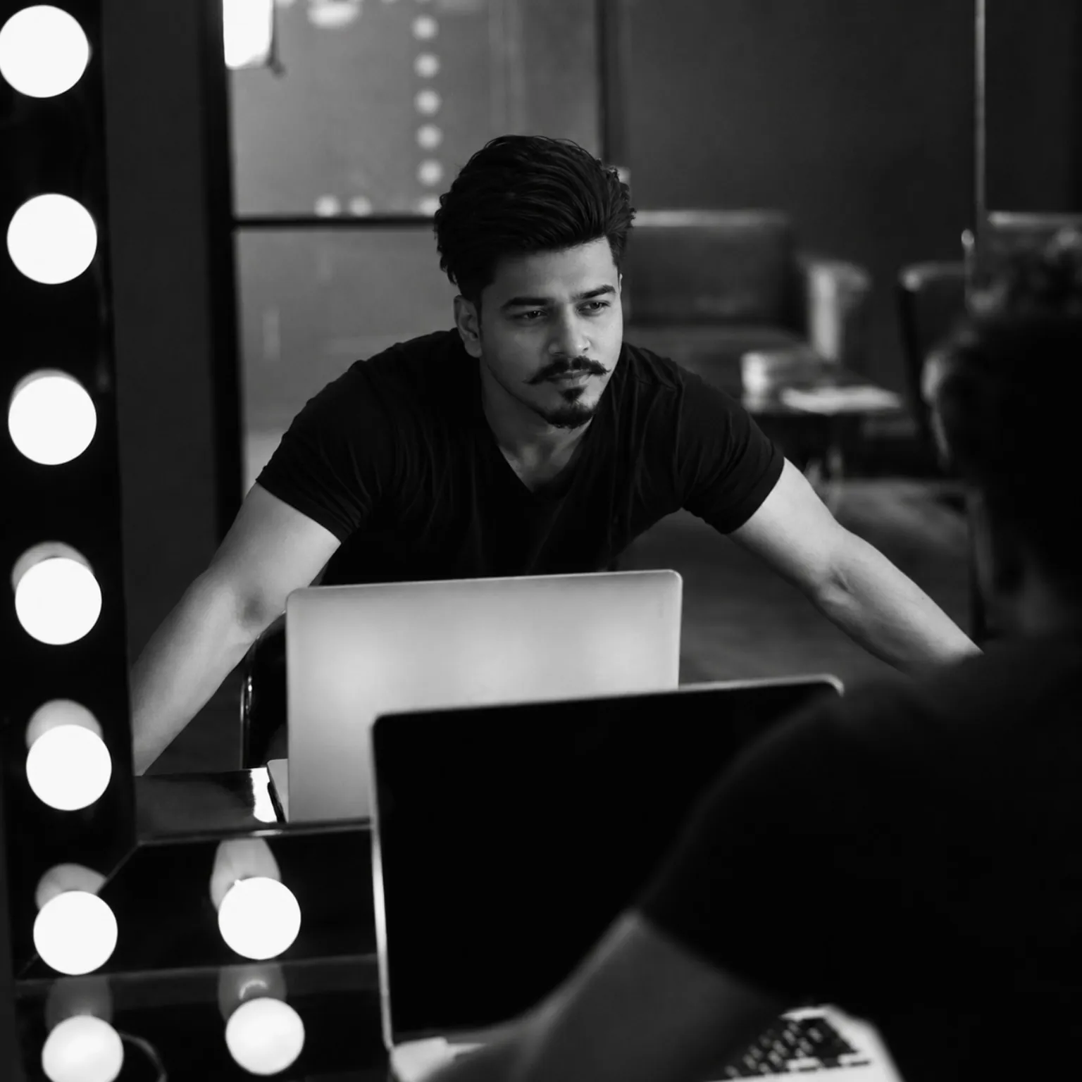 Sanzat Hasan Tuhin working at a laptop